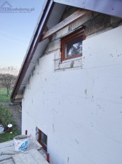 garaż wolno stojący dwustanowiskowy, wykończenie elewacji styropianem i tynkiem jak dom
